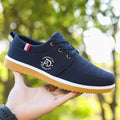 Non-slip men's casual work shoes in black canvas with platform heel and leather toe cap