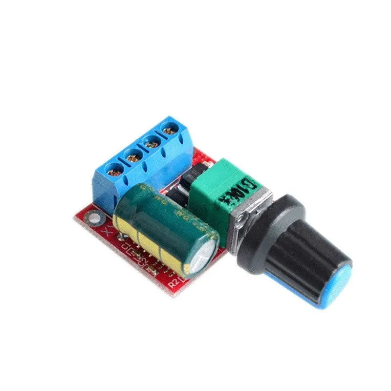 Small green PCB DC motor governor with black potentiometer knob for 5V-35V speed control