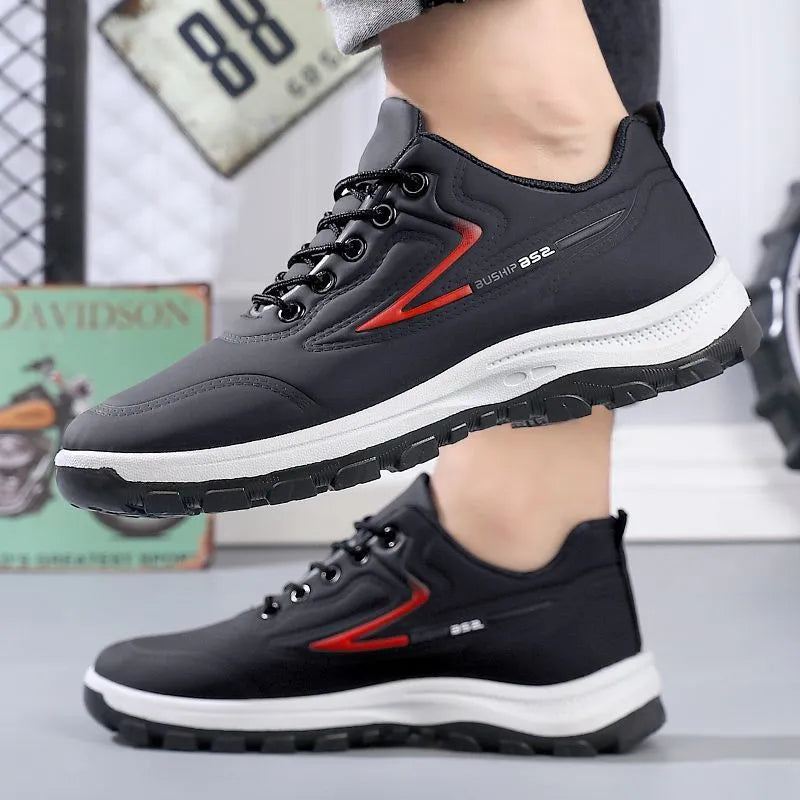 Waterproof leisure soft bottom sports work shoes in black and gray, low top, lace-up front, artificial PU upper