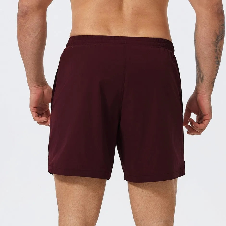 Men's moisture-wicking nylon running basketball tennis shorts in black, mid waist design
