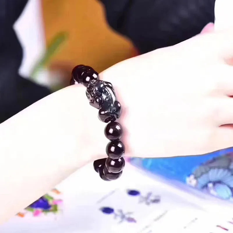 Natural ice colour eye obsidian crystal bracelet with round beads on wrist