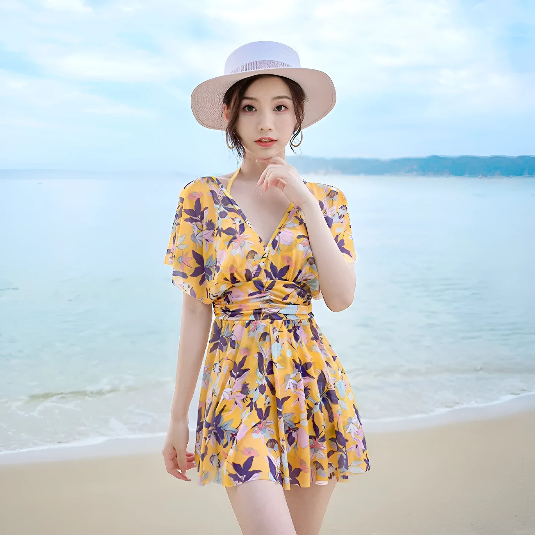 Women's yellow floral one-piece swimsuit with attached skirt, made from polyester, available in multiple sizes
