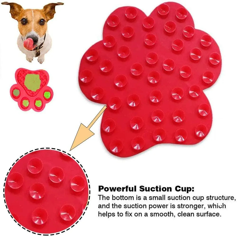 Blue bone-shaped silicone dog licking mat with suction cups on a shower tile.
