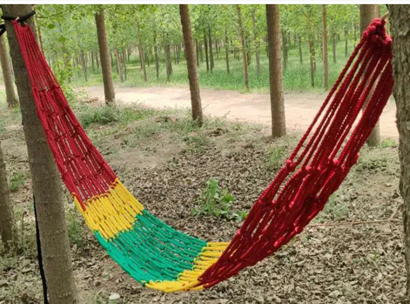 Nylon rope mesh hammock hanging between trees with bold weave pattern, showing 1.1m width