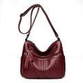 Genuine leather horizontal square messenger bag with contrasting stitching and single shoulder strap in black