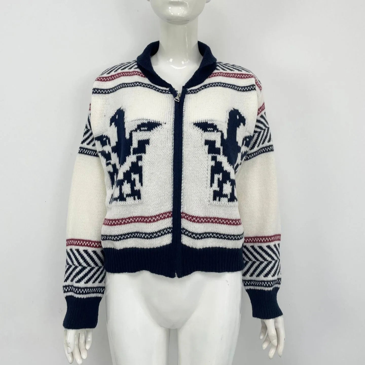 White women's wool zip cardigan with lapel collar and black jacquard contrast stripes.