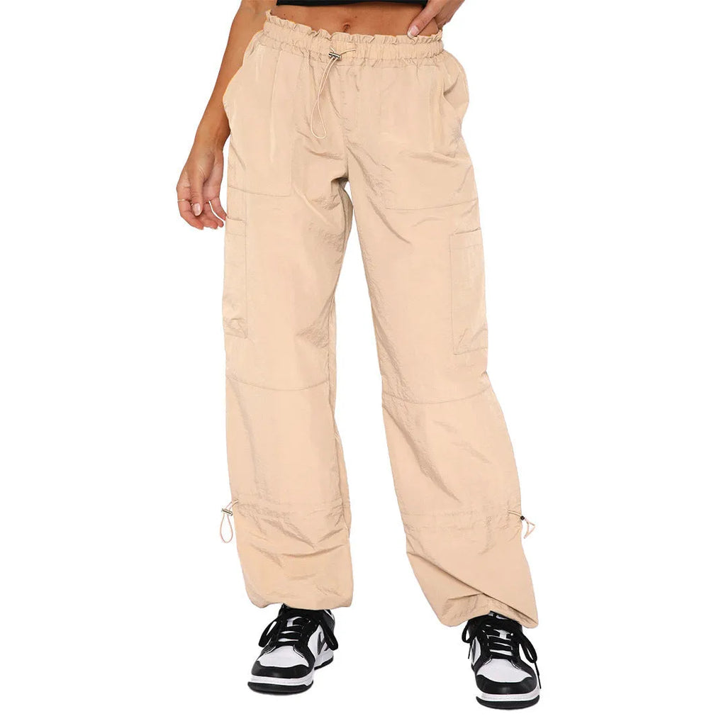 Loose-fit straight-leg cargo casual pants in grey with multiple pockets, shown on a hanger.