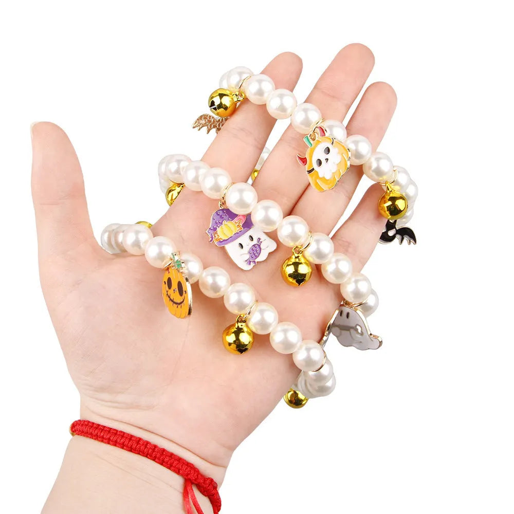 3 imitation pearl pet necklaces with small bells on adjustable cords for Halloween decoration