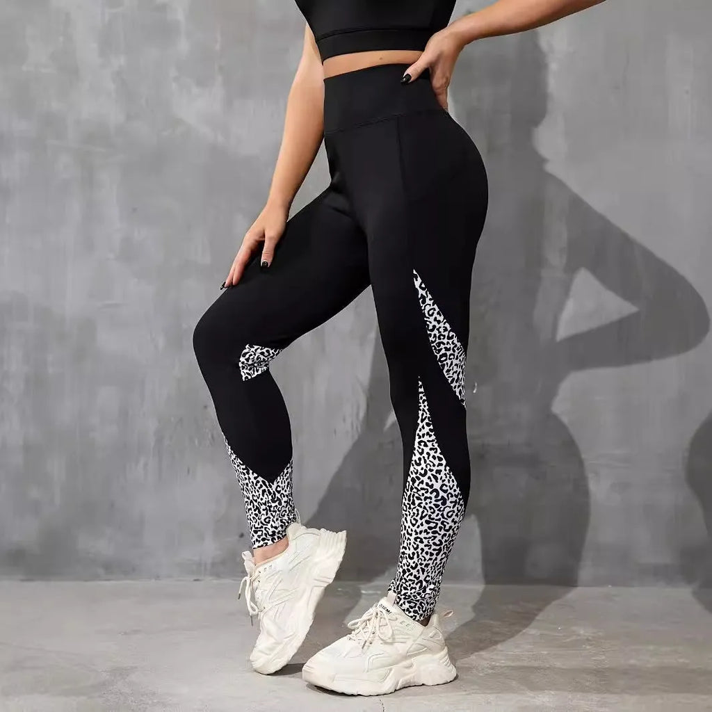Woman wearing black ribbon letters colour contrast patchwork high waist yoga leggings with pocket