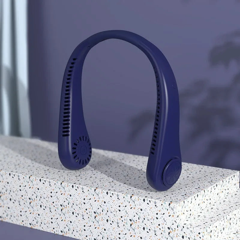 Pink portable bladeless neck fan being worn, showing USB charging port and control button.