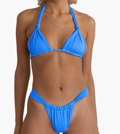 Women's pink pleated knotted bikini swimsuit with split straps on a mannequin.