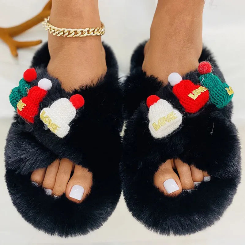 Women's faux plush slippers with a Christmas hat decoration, shown in a choice of colours.