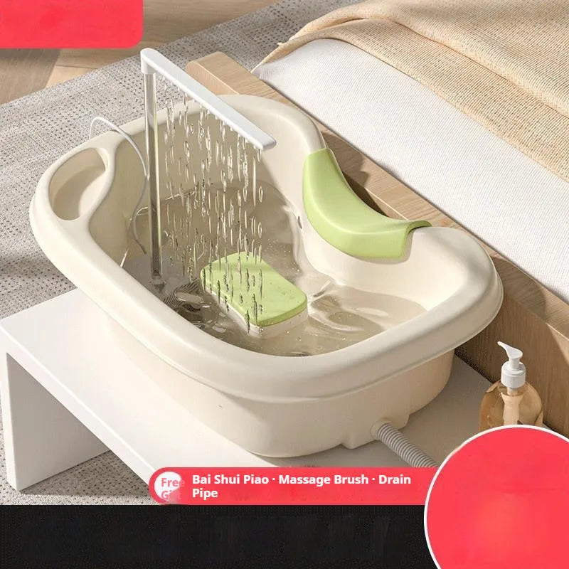 Shampoo basin for bed use with head pillow and water pump in light pink and beige colours