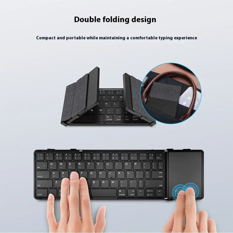 Black folding Bluetooth keyboard for mobile phones and tablets showing compact folded size