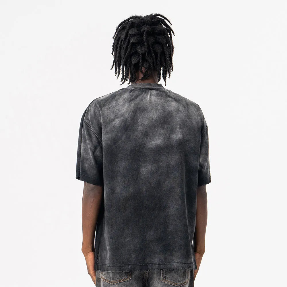 Black men's loose fit cotton t-shirt with printed letter pattern and drop-shoulder short sleeves.
