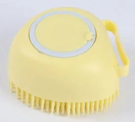 Blue silicone dog bath brush with flexible bristles on a white background
