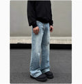 Men's retro whisker washed blue straight jeans with visible stitching and medium-high waist.