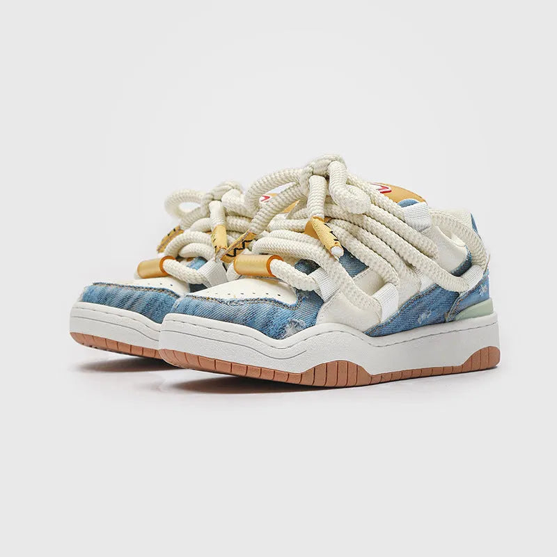 A pair of low-top unisex casual shoes with a round toe, thick rubber sole, and lace-up front on a white background.