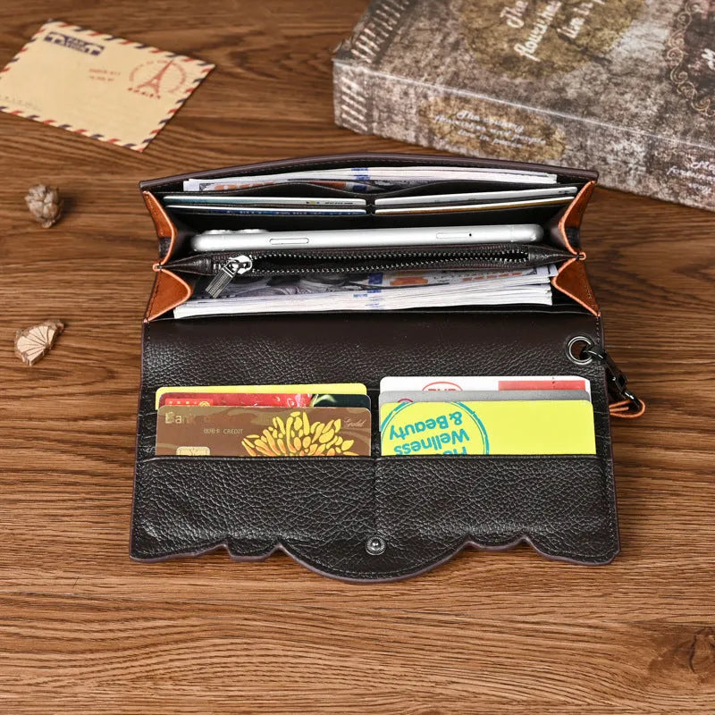 Chinese style embossed leather wallet in tri-fold design showing floral pattern on brown cowhide