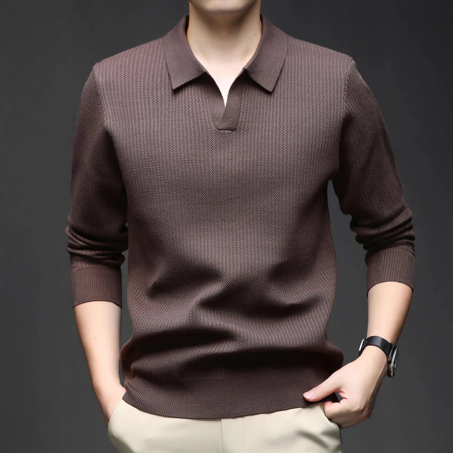 Man wearing a loose green casual pullover sweater for autumn.