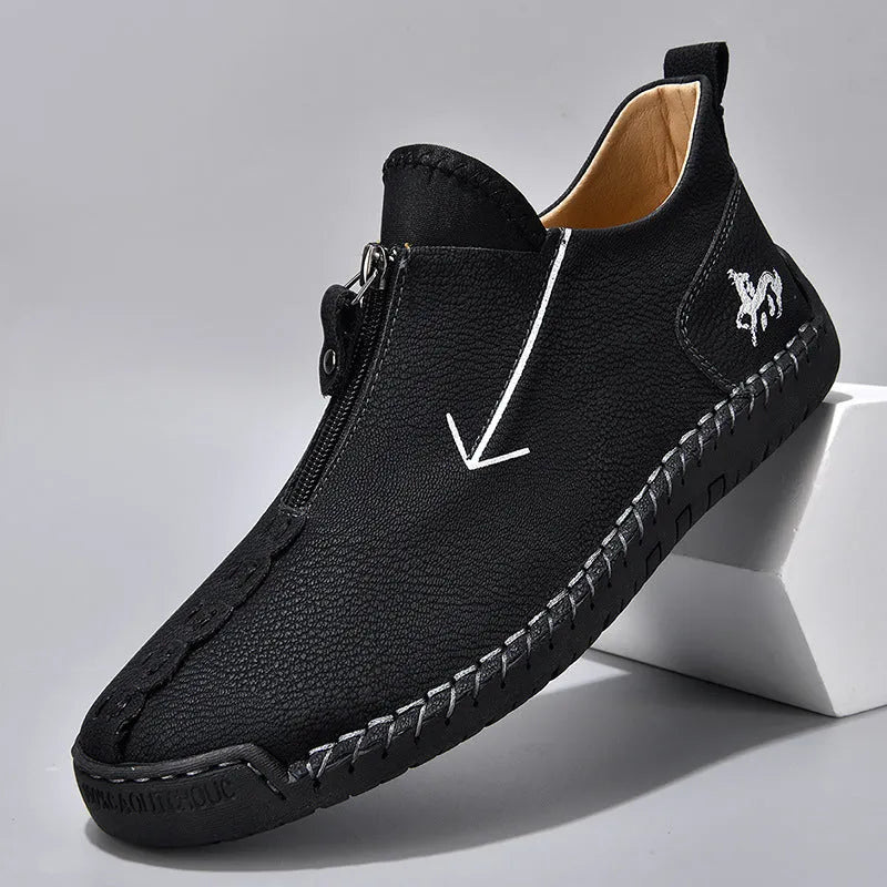 Men's brown leather-look martin boots with a front zipper and round toe on a rubber sole.