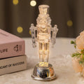 Transparent plastic walnut soldier nutcracker Christmas ornament decoration on desktop