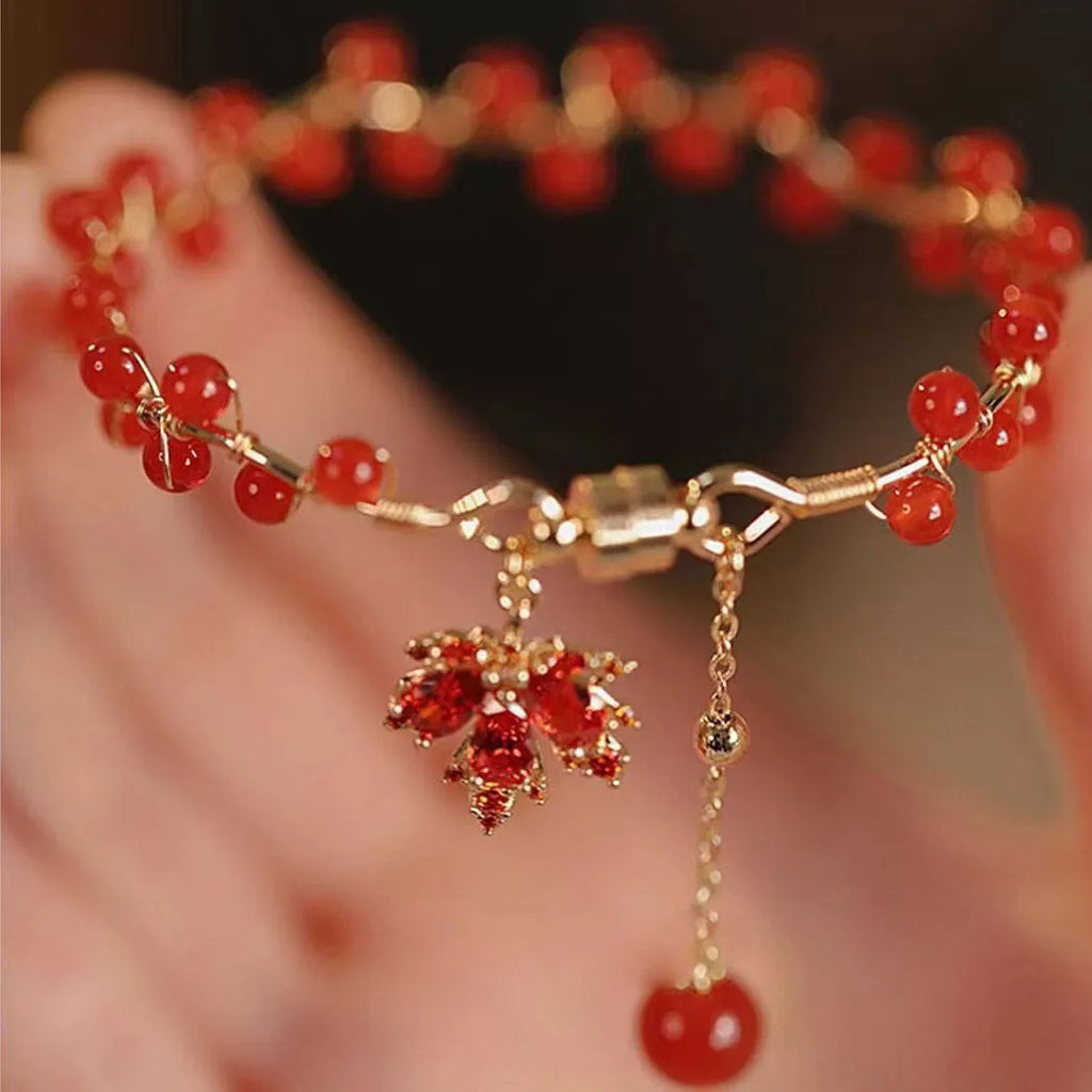 Maple Leaf Girl red ginkgo leaf magnetic bracelet on wrist, electroplated alloy finish