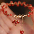 Maple Leaf Girl red ginkgo leaf magnetic bracelet on wrist, electroplated alloy finish