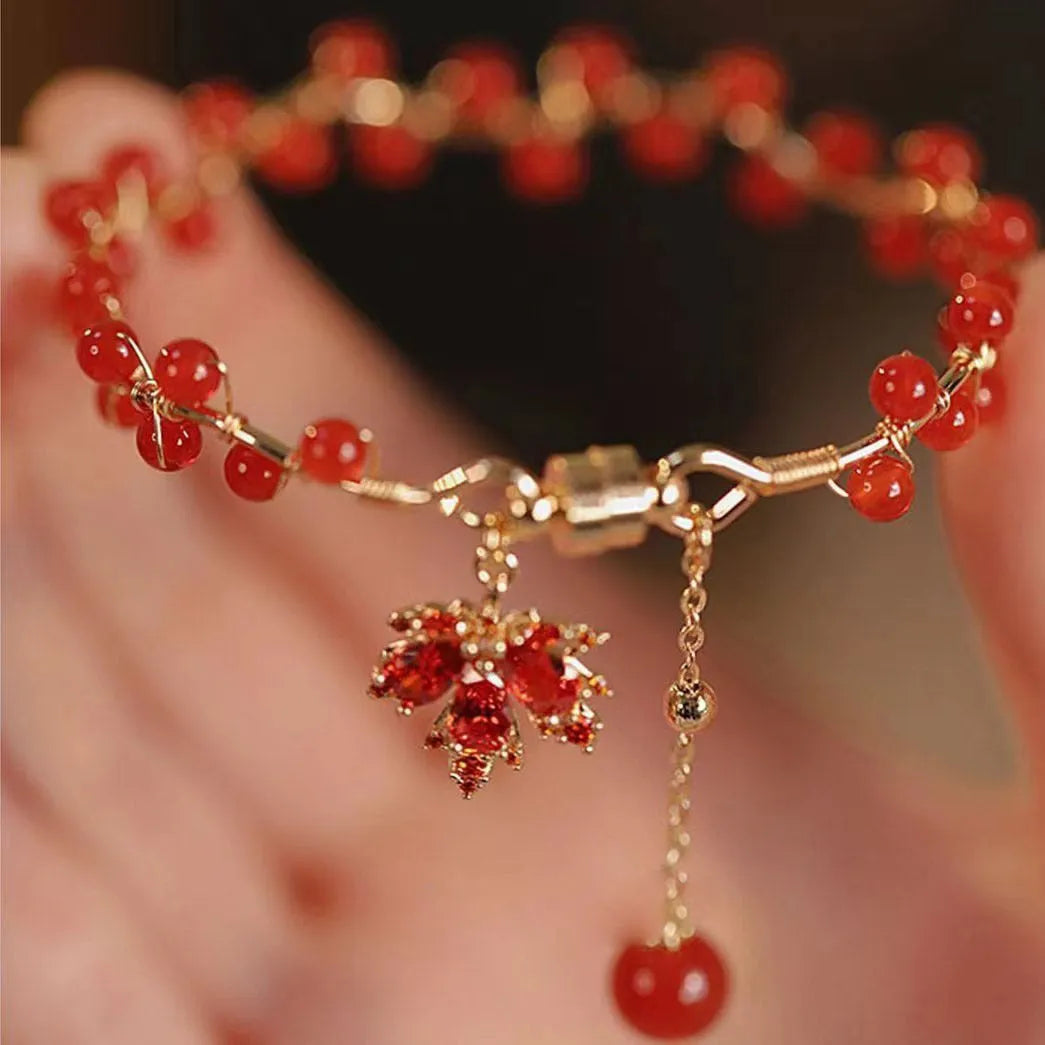 Maple Leaf Girl red ginkgo leaf magnetic bracelet on wrist, electroplated alloy finish