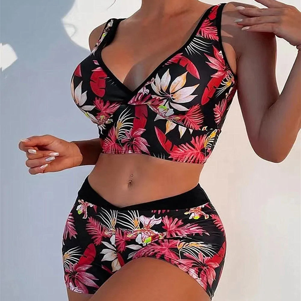 Women's two-piece swimsuit set with printed boxer briefs and sleeveless top in a multi-colour pattern.