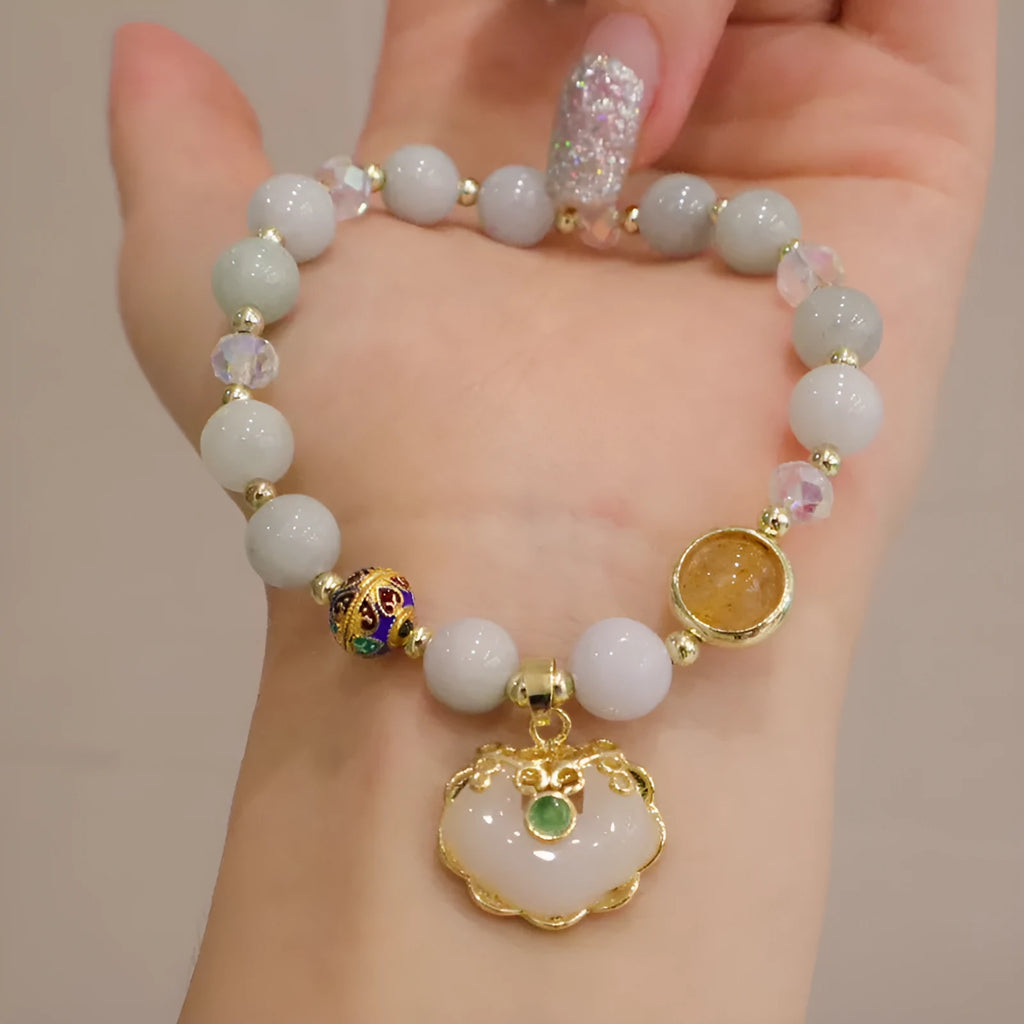 Geometric women's bracelet in gray jade and strawberry quartz with metal ethnic decoration