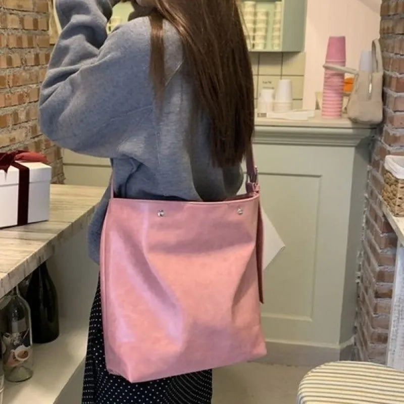 Corduroy one-shoulder commuter bag in pink or brown colour with PU lining