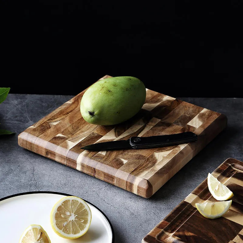 Brown parquet solid wood cutting board made from imported acacia, 3cm thick, on kitchen counter