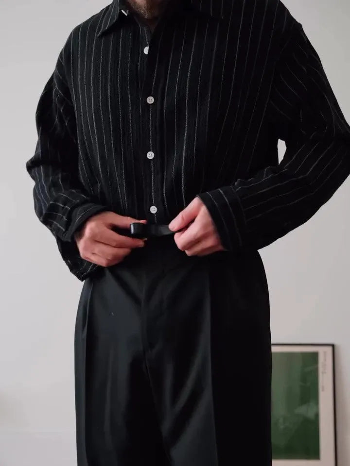 Black pinstriped button-down shirt with regular fit and striped pattern on polyester fabric