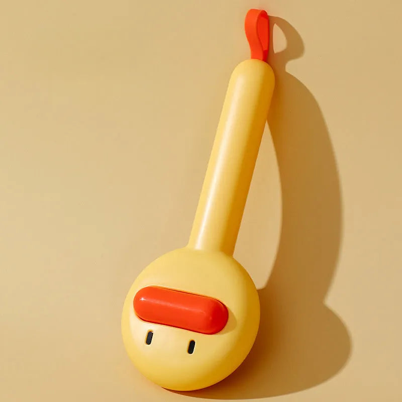 Small yellow duck-shaped pet comb for cat and dog grooming with needle teeth