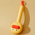 Small yellow duck-shaped pet comb for cat and dog grooming with needle teeth