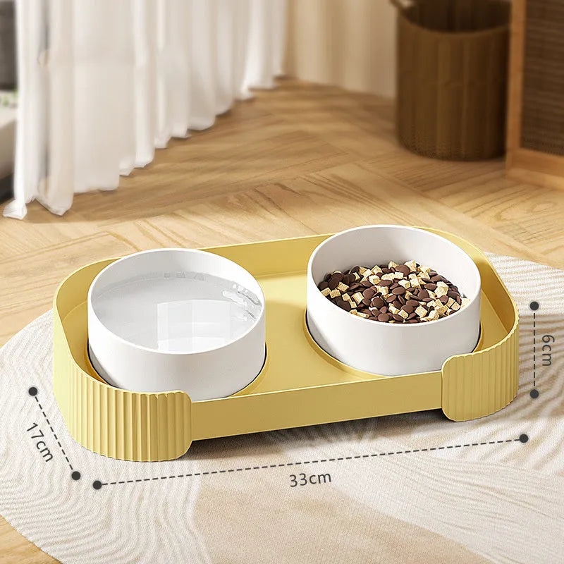 Green and white ceramic elevated cat bowl set with tilted stand and two bowls for food and water.