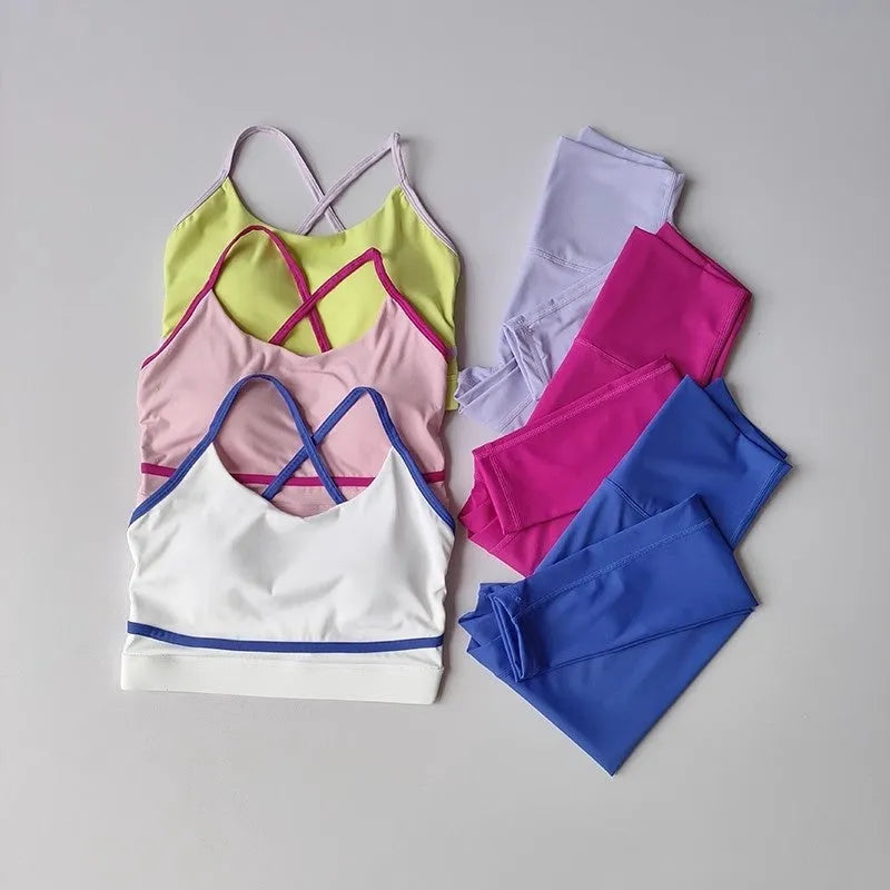 Women's blue and white quick dry yoga set with cropped pants and sleeveless tank top on white background