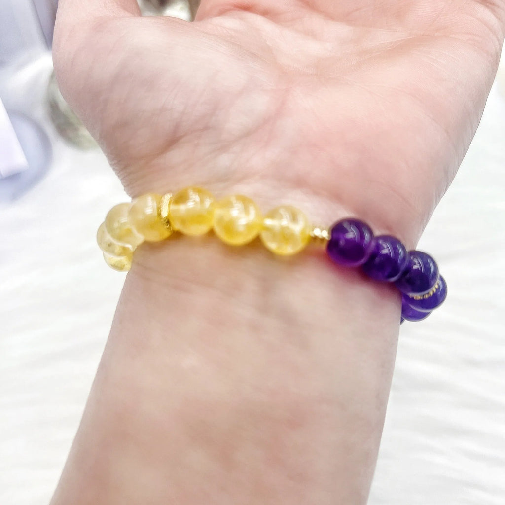 Handmade women's bracelet with yellow and purple amethyst crystal beads