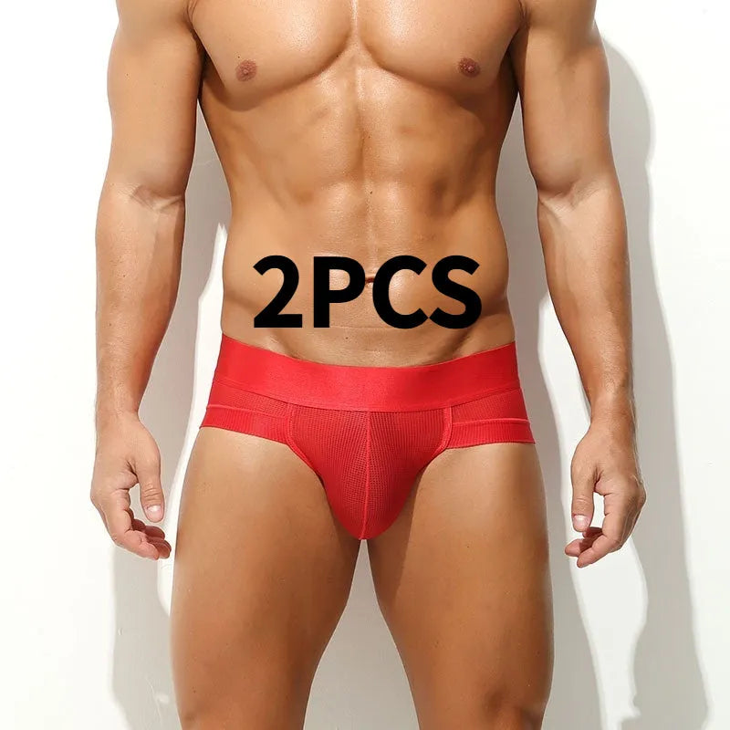 Men's ice silk mesh low-rise briefs in black solid colour on a plain background