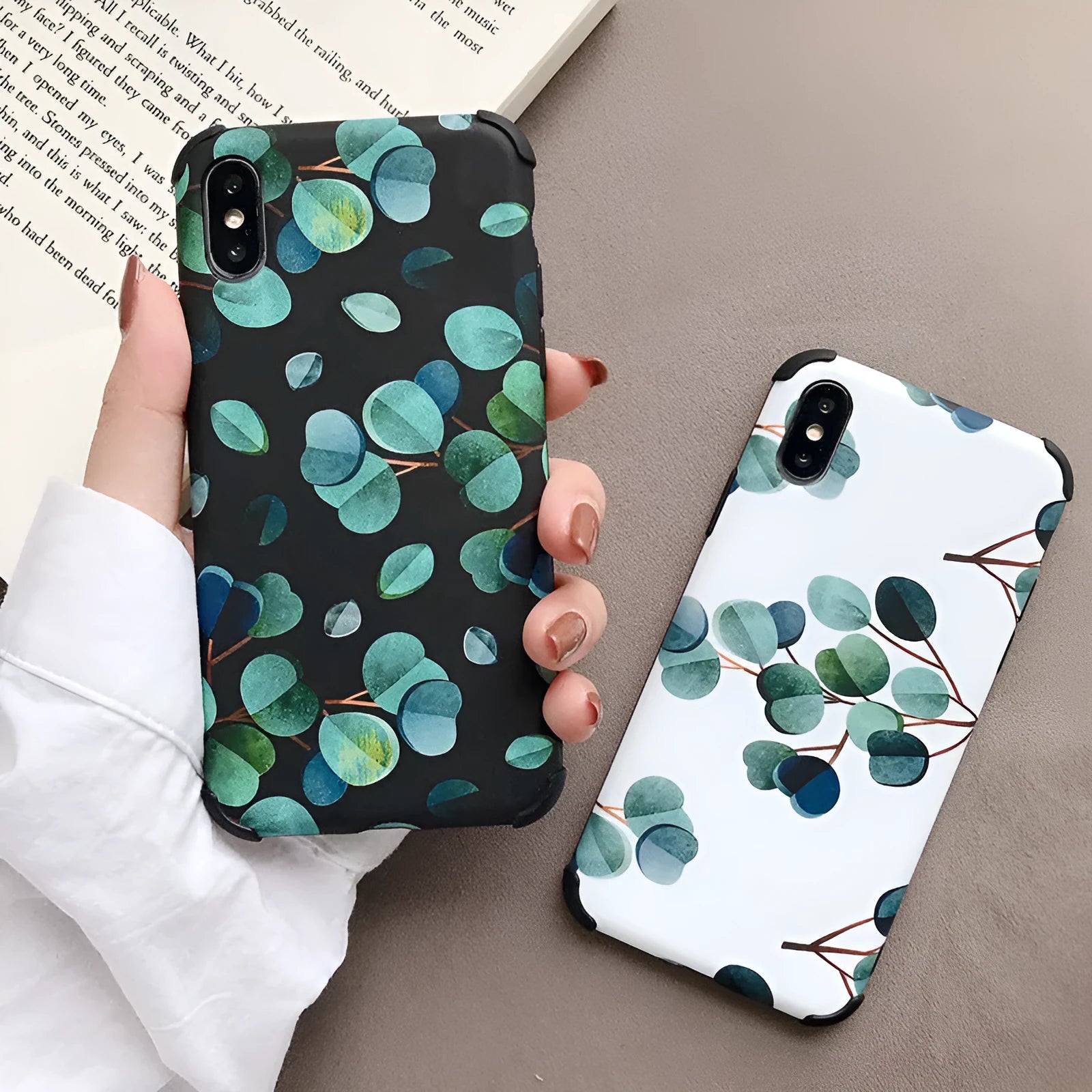 Black silicone iPhone case with a raised leaf pattern on the back.