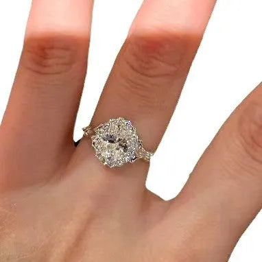 Silver geometric ellipse women's ring with adjustable opening on a white background.