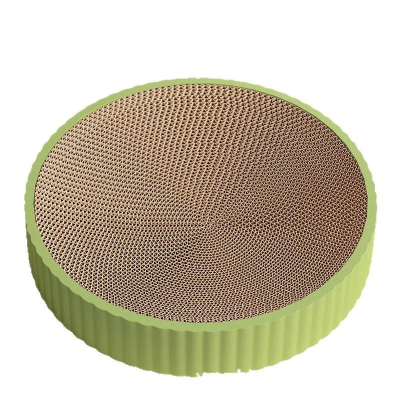 Round green and white cat scratching board nest measuring 55cm with corrugated paper surface.