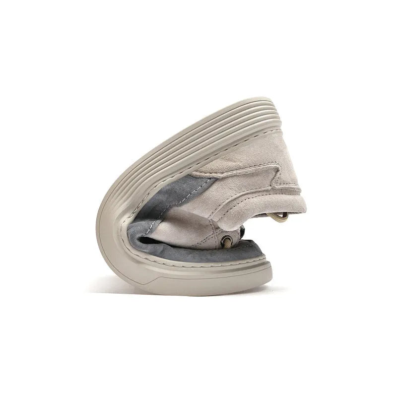 Men's grey low-top casual skate shoes with a pigskin leather upper and rubber sole.