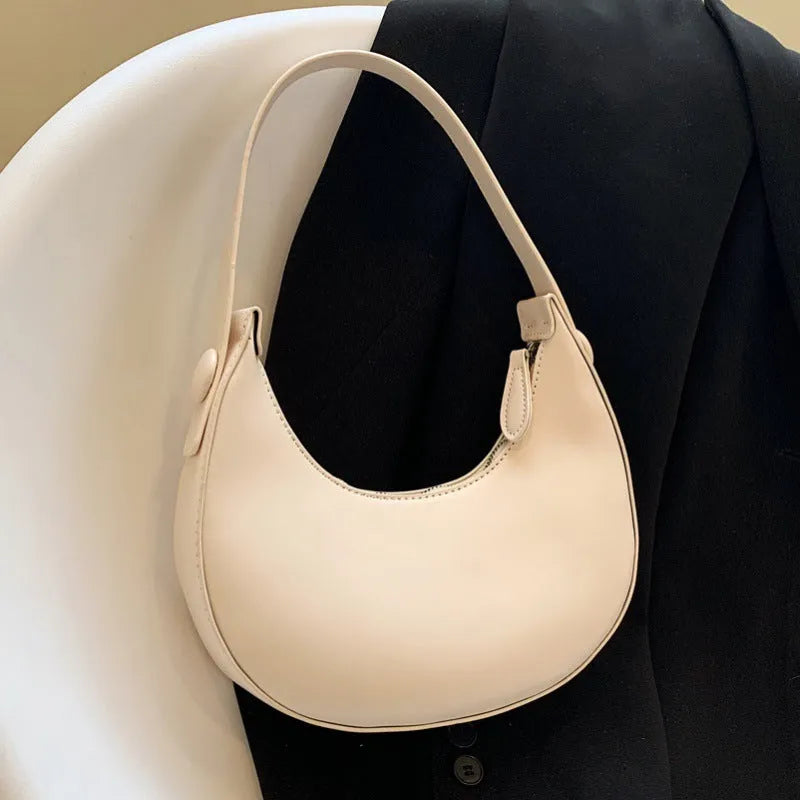 Retro dumpling-shaped women's PU leather shoulder bag in black with sandwich pockets