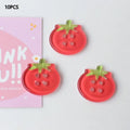 Tomato button ornament made of plastic or resin with printed pattern in medium size mixed colours