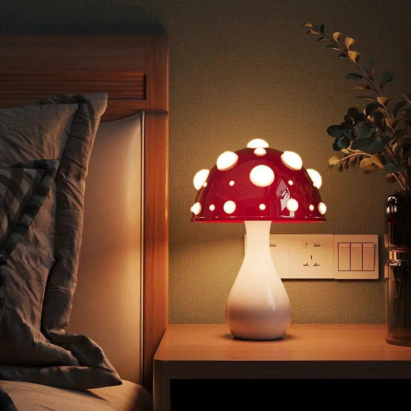 Mushroom decorative table lamp with white base and tricolour light on a wooden nightstand