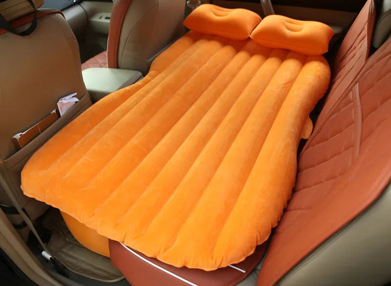 Car inflatable bed with 0.5mm flocking cloth in black wave, including pillows and pump, set up in a car rear seat