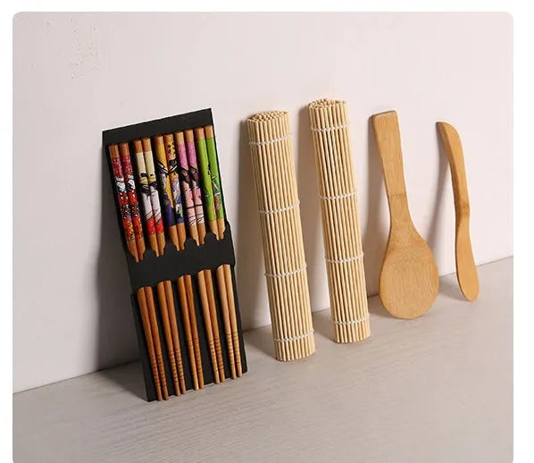 White sushi tool set with bamboo rolling mat and rice paddle for making sushi at home