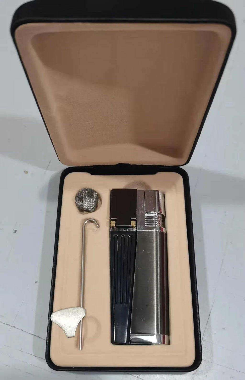 Foldable 2-in-1 metal pipe lighter and refillable butane smoking gadget with silver square cover on a dark background